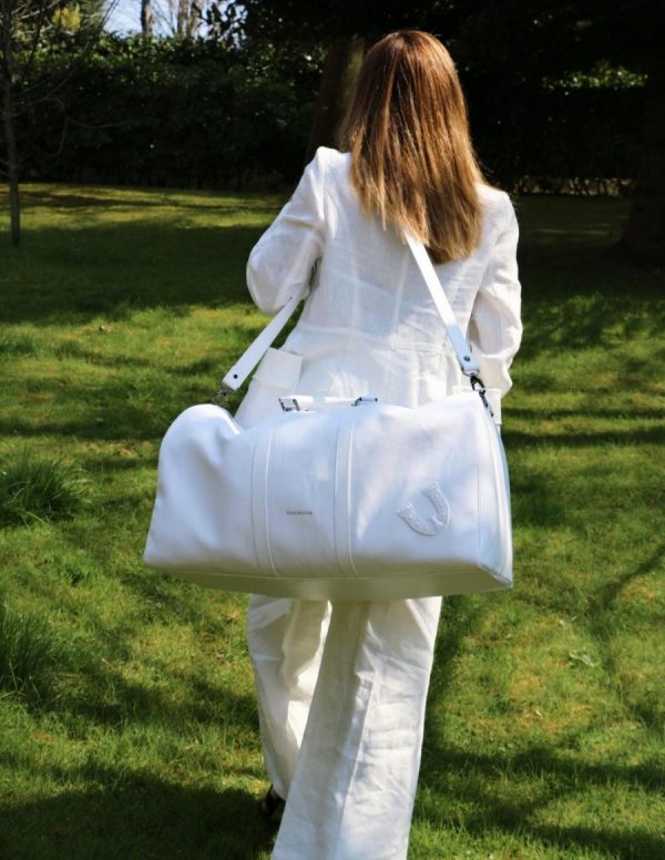 Weekender White Travel Bag Carried By a Woman